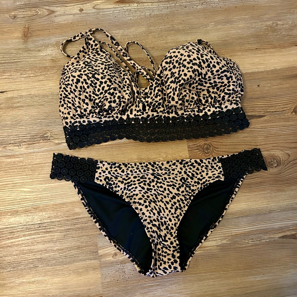 Cute Animal print bikini with crochet detail. Excellent condition.